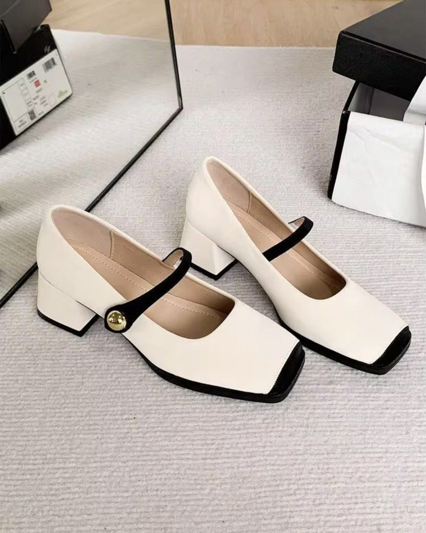 White Mary Jane Heels with Black Toe Cap and Strap (Category: Heels) located in Manila. Submitted by yunabiiiii (Listing ID 1459945157, Image 2). Description: - Cute white Mary Jane heels - Black strap with gold button detail - Square toe with black cap - Comfortable block heel Rfs: Too big for me / Wrong Size Bought in Saudi, No Box .