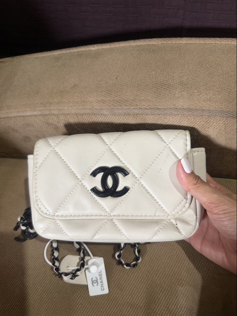 White Quilted Chanel Flap Bag with Chain Strap with serial (Category: Luxury Bags & Wallets) located in San Fernando. Submitted by japanvintageaccessories (Listing ID 1453139263, Image 1). Description: - White quilted flap bag - Iconic black Chanel logo - Black and white chain strap - Includes Chanel charm - Interior small compartment - Secure snap button closure - Ideal for carrying essentials.