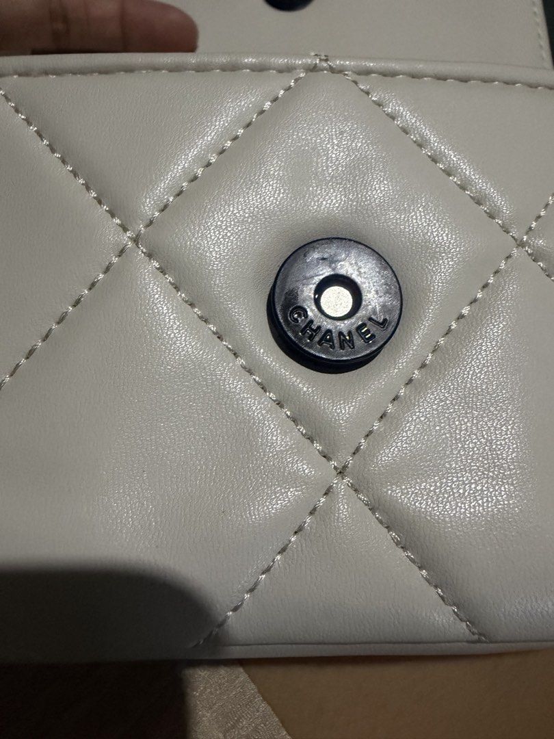 White Quilted Chanel Flap Bag with Chain Strap with serial (Category: Luxury Bags & Wallets) located in San Fernando. Submitted by japanvintageaccessories (Listing ID 1453139263, Image 2). Description: - White quilted flap bag - Iconic black Chanel logo - Black and white chain strap - Includes Chanel charm - Interior small compartment - Secure snap button closure - Ideal for carrying essentials.