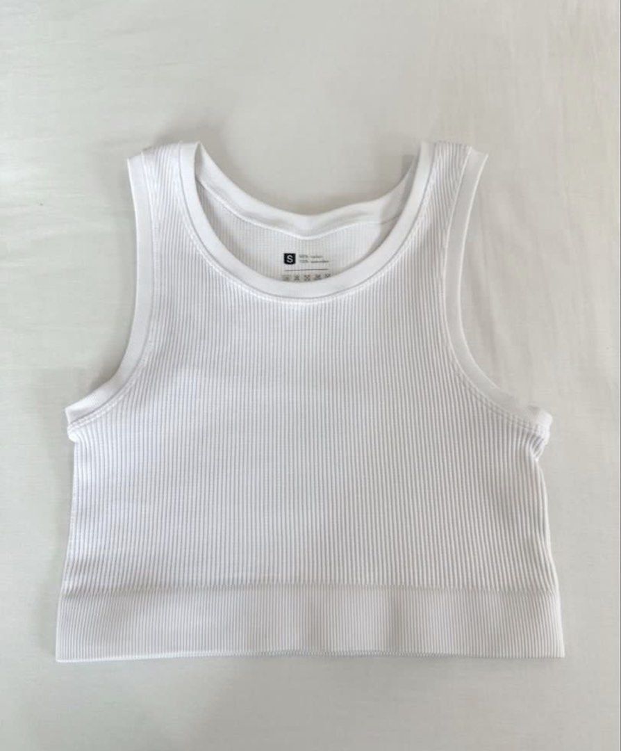 White Ribbed Halter Top (Category: Sleeveless) located in San Juan City. Submitted by keep.it.clean (Listing ID 1459992678, Image 1). Description: Ribbed material Get both for ₱350 Length 34 cm Bust 33cm helping tags: h&m, zara, bershka, cotton on, uniqlo .