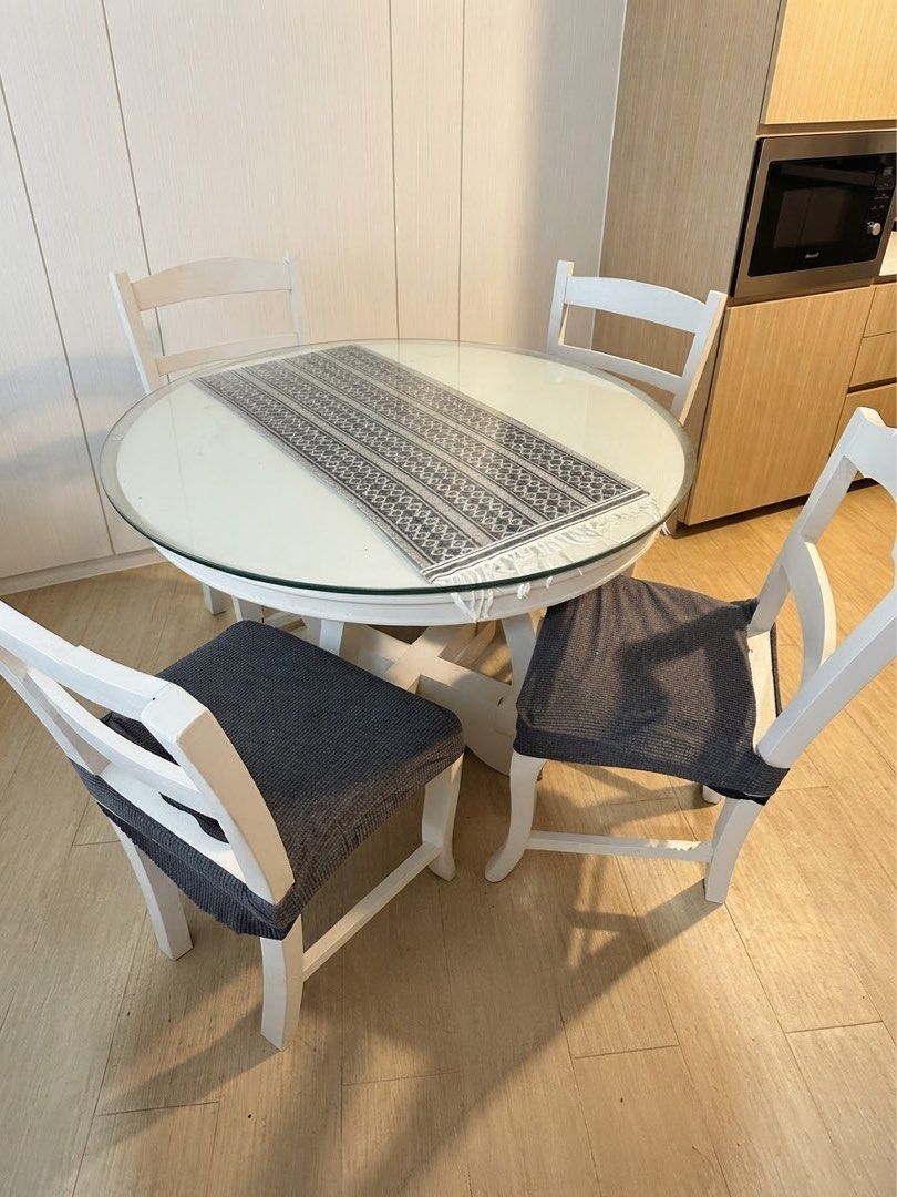 White Round Dining Table with 4 Chairs (Category: Tables & Sets) located in Calamba. Submitted by snowbear123 (Listing ID 1459972220, Image 1). Description: FOR SALE Item: Modern 4-Seater Round Dining Table with Glass Top Negotiable ✅ Send a message if you’re interested!.