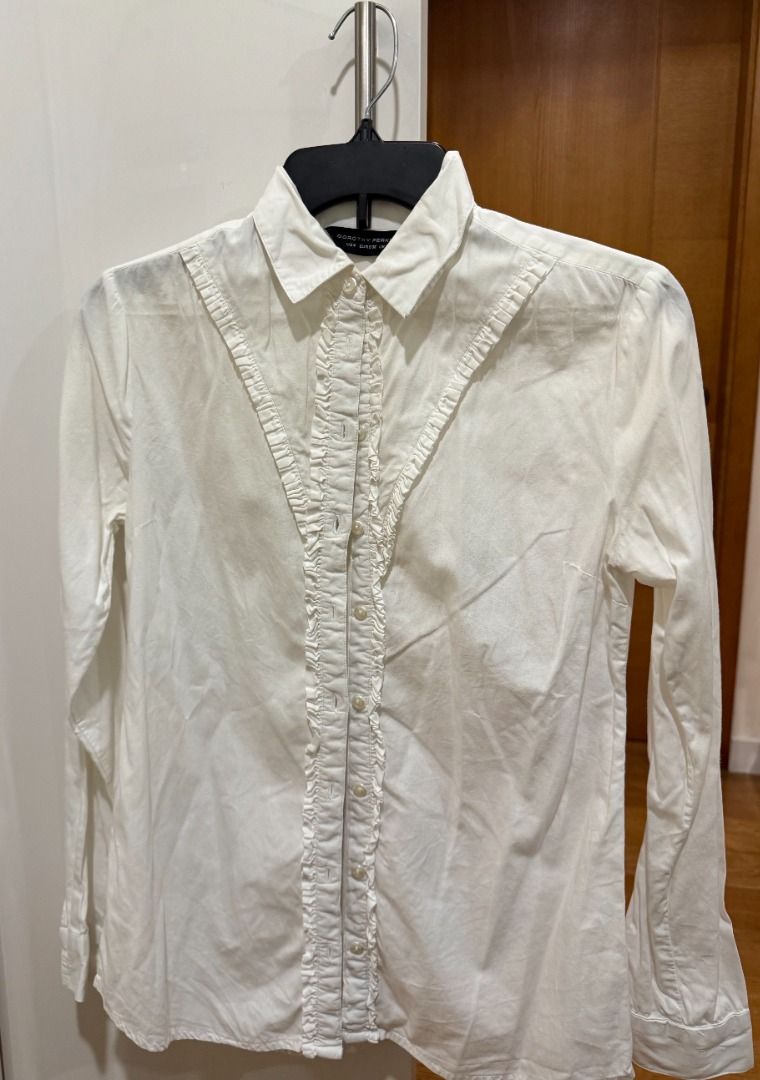 DOROTHY PERKINS WHITE V-RUFFLE BUTTON-DOWN BLOUSE (Category: Blouses) located in Makati City. Submitted by fpled (Listing ID 1460051120, Image 1). Description: ✨ DOROTHY PERKINS WHITE V-RUFFLE BUTTON-DOWN BLOUSE ✨ • Size Small (UK 8 / EUR 36 / US 4) • V-Bib Ruffle Accent A crisp, chic white long-sleeve blouse from Dorothy Perkins featuring a flattering V-shaped ruffle bib detail along the chest and down the front button placket. A timeless wardro