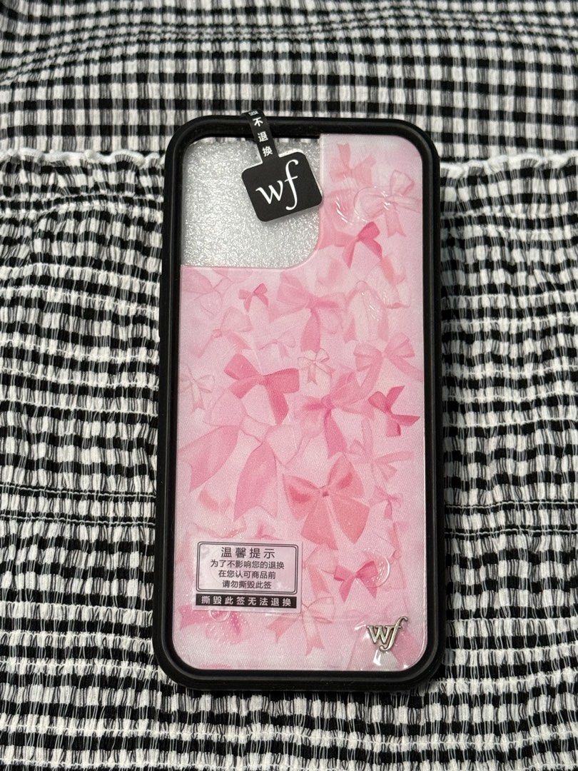 iPhone 16 Pro Max WILDFLOWER Bow Beau (Category: Cases & Sleeves) located in Indang. Submitted by ayanaonfit (Listing ID 1460023597, Image 2). Description: Hey there! ✨ Check out this super cute WILDFLOWER Bow Beau phone case! Perfect for adding a touch of sweetness to your phone. It features a lovely pink background with an all-over bow pattern that's just adorable. 😉.