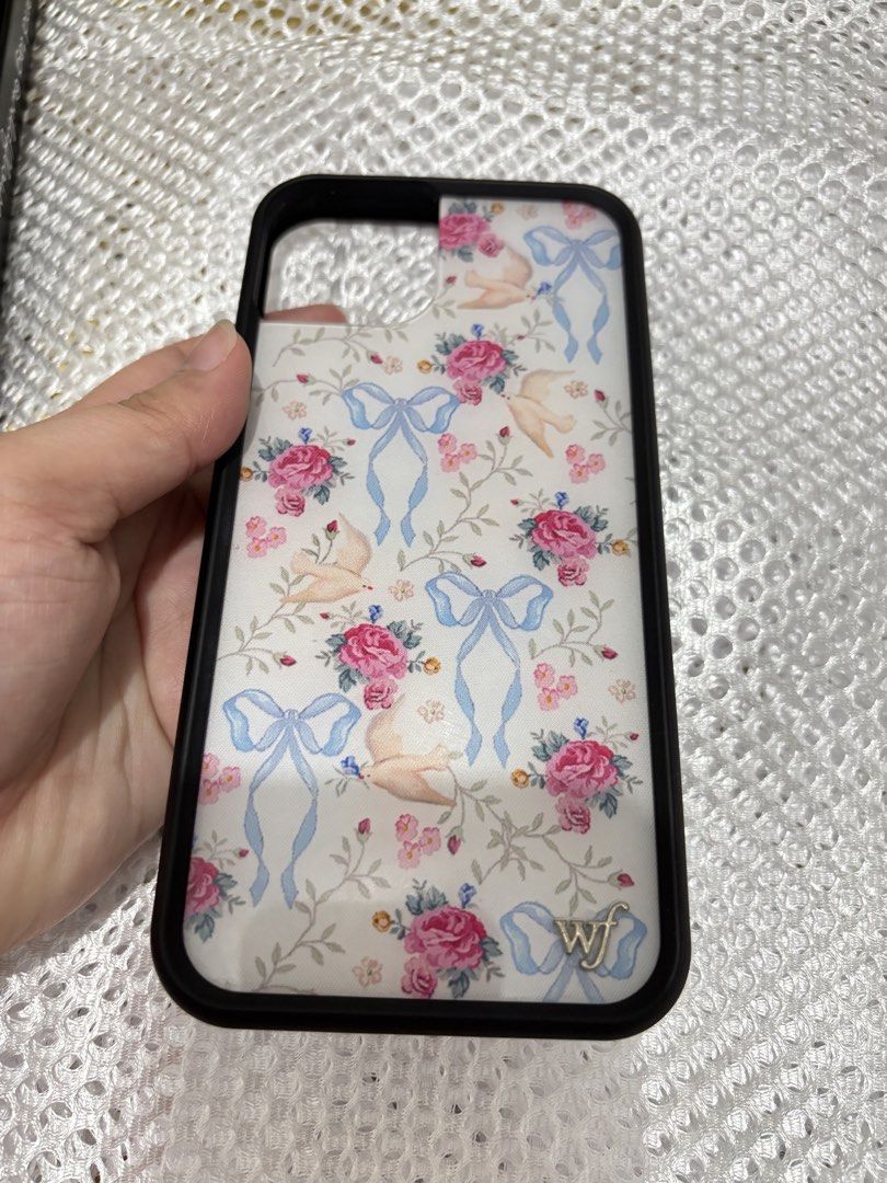 Wildflower Iphone 15 Plus Case (Category: Cases & Sleeves) located in Quezon City. Submitted by ccloset_ (Listing ID 1459909053, Image 2). Description: - Brand: Wildflower - Model: iPhone 15 Plus - Design: Vintage floral print with roses, birds, and blue ribbons - Condition: Excellent, like new - Style: Adds a charming and unique touch to your phone .