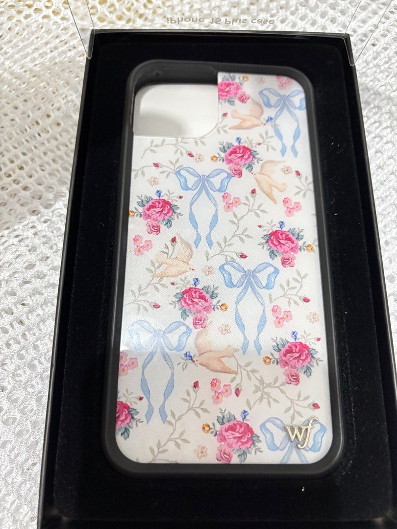 Wildflower Iphone 15 Plus Case (Category: Cases & Sleeves) located in Quezon City. Submitted by ccloset_ (Listing ID 1459909053, Image 1). Description: - Brand: Wildflower - Model: iPhone 15 Plus - Design: Vintage floral print with roses, birds, and blue ribbons - Condition: Excellent, like new - Style: Adds a charming and unique touch to your phone .