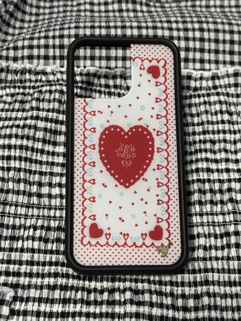 iPhone 16 Pro Max WILDFLOWER Lovers Lane Phone Case (Category: Cases & Sleeves) located in Indang. Submitted by ayanaonfit (Listing ID 1460023244, Image 1). Description: - Brand: WILDFLOWER - Design: Lovers Lane (Red heart, tiny hearts, decorative border) - Condition: Great - Style: Romantic, sweet, charming.