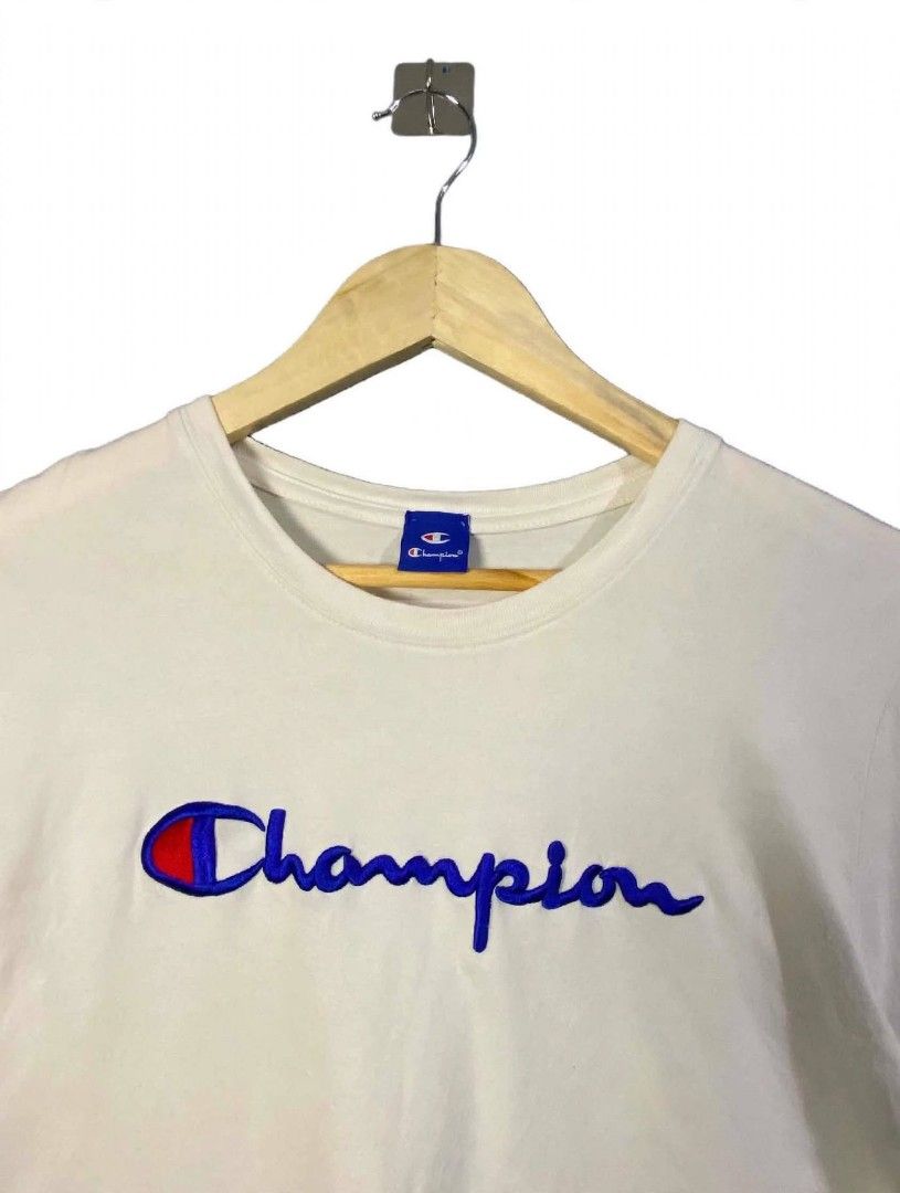 Women's Champion script logo embroidered whiter (Category: Shirts) located in Taguig. Submitted by owlthrifty (Listing ID 1460081988, Image 2). Description: Medium size Good as new ✔️💯 In excellent condition ✔️💯.