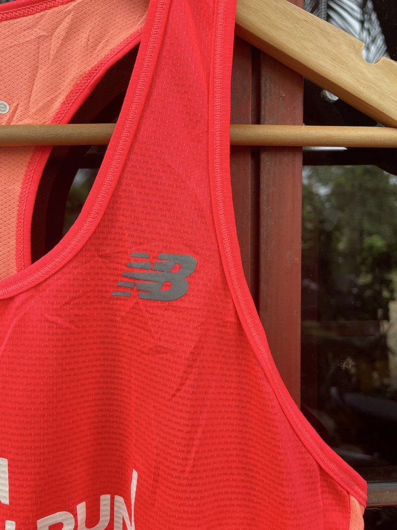 WOMENS RUNNING SHIRT (Category: Sleeveless) located in Quezon. Submitted by thriftedbyandie (Listing ID 1460029388, Image 3). Description: This is a bright orange-red New Balance running singlet from the 2018 Taishin Women Run Taipei event, featuring the Taishin Bank logo on the chest..