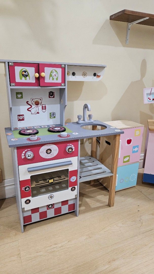 Wooden Toys Set (Category: Infant Playtime) located in Paranaque City. Submitted by babythings (Listing ID 1459924681, Image 2). Description: PRICE VARIES ON WHAT TOY TO GET - Kitchen with Ref -Cart with wheels -Salon -Pizza -Ice Cream Store - Wooden toy set featuring a play kitchen and an ice cream cart. - Made from durable wood for long-lasting play. - Play kitchen includes oven, sink, and stovetop details. - Ice cream cart adds to the imaginat