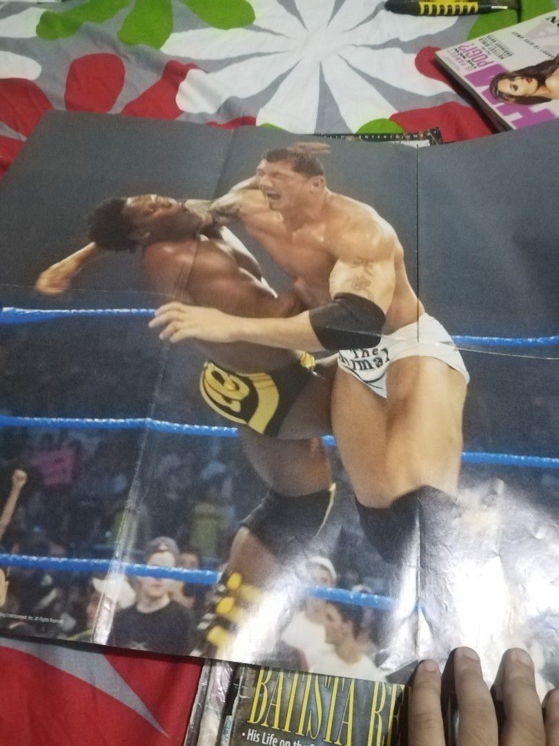 WWE SmackDown Magazine - Batista Cover (Category: Magazines) located in Manila. Submitted by pickerjessie (Listing ID 1460060840, Image 3). Description: - WWE SmackDown magazine featuring Batista on the cover. - Includes a giant, collectible Batista poster inside. - Content also features Melina and other wrestling news. - A must-have for any dedicated WWE fan. - Own a piece of wrestling memorabilia..