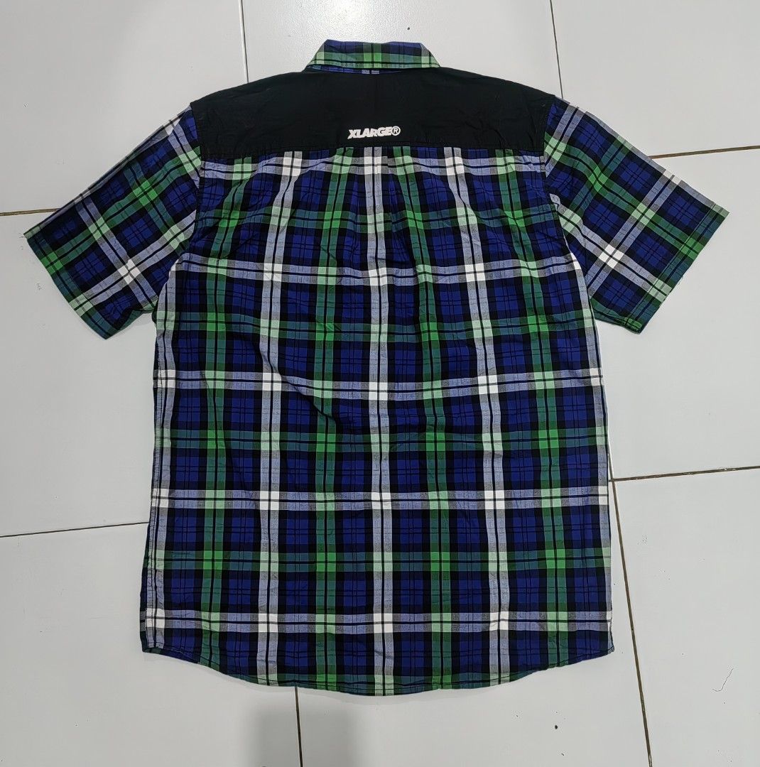 XLARGE Plaid Short Sleeve Shirt (Category: Tshirts & Polo Shirts ) located in Guihulngan. Submitted by wengweng41294 (Listing ID 1460032709, Image 2). Description: - XLARGE Short Sleeve Button-Up Shirt - Classic blue, green, and white plaid pattern - Stylish black accents on shoulders and back yoke - Subtle embroidered logo on chest pocket - Made from comfortable 100% cotton - Perfect for everyday casual wear - Size XL (22W 30L) - No issue. Excel