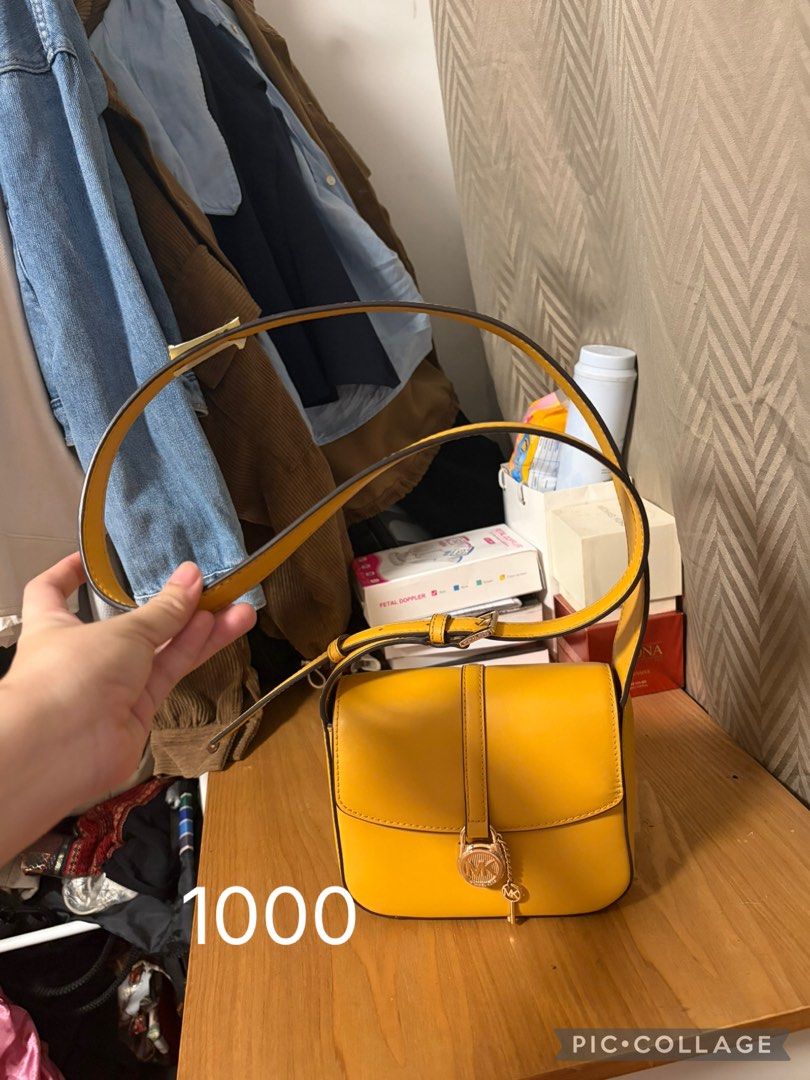 Yellow Michael Kors Crossbody Bag (Category: Cross-body Bags) located in Consolacion. Submitted by kkk_declutter (Listing ID 1460045995, Image 1). Description: - Adorable yellow crossbody bag - Compact size, ideal for essentials - Interior pockets for organization - Adjustable strap for comfortable wear - Elegant gold-toned hardware - Versatile for everyday use or evening outings Location Casili Consolacion Pay First Buyer Shoulders the delivery 