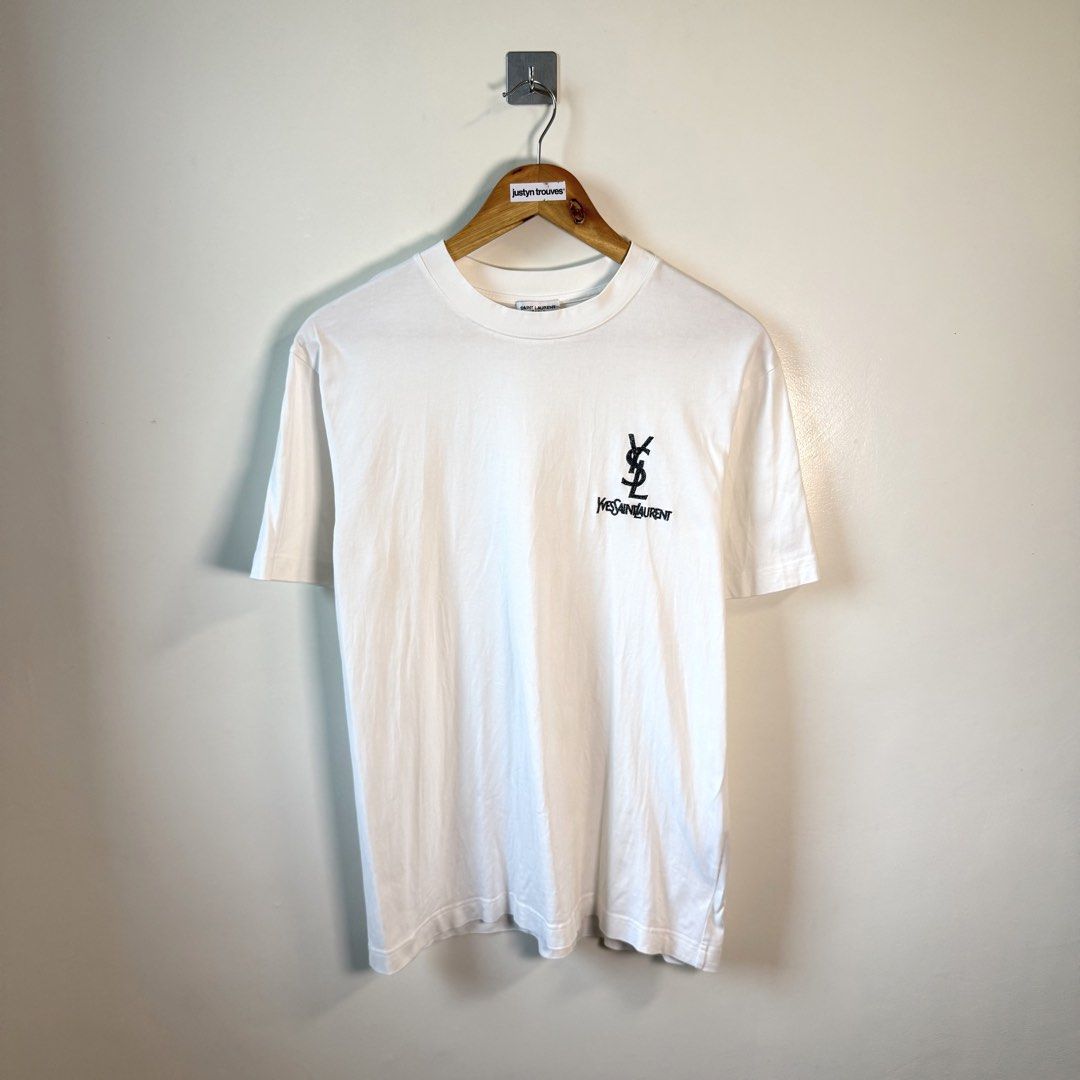 YSL CHEST LOGO DESIGN WHITE (Category: Tshirts & Polo Shirts ) located in Paniqui. Submitted by justyntrouves (Listing ID 1459938085, Image 1). Description: Tag Size: Small (Dimensions in inches) Width: 20 Length: 27.5 Condition: 8/10 Armpit stains not sure washable Buyer will shoulder the shipping fee. Check all photos before purchasing. For any questions, feel free to ask. .
