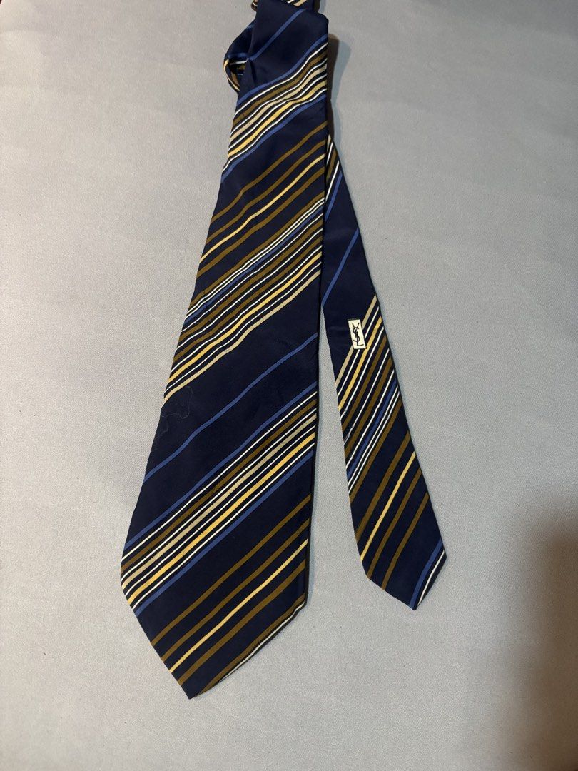 Yves Saint Laurent YSL navy pattern necktie (Category: Ties) located in Manila. Submitted by maxxxxxxxxxxxx (Listing ID 1459922222, Image 2). Description: For sale Authentic Vintage YSL Necktie STRIPE TYPE colour pattern Navy blue base colour Silk material super soft Has some dirt needs wash .