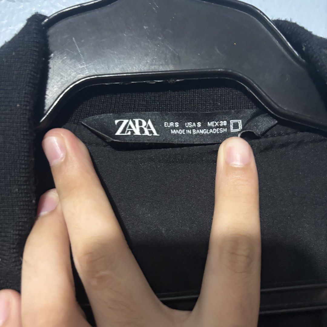 ZARA Black Bomber Jacket (Category: Coats, Jackets and Outerwear) located in Manila. Submitted by shosellthrift (Listing ID 1459967952, Image 2). Description: - Classic black Zara bomber jacket - Size S - Simple design, great for layering - Ribbed cuffs and hem - Zipper closure - Made in Bangladesh.