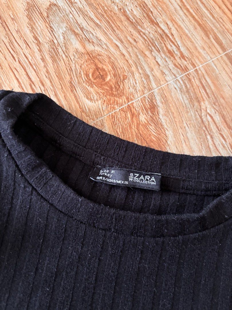 Zara Black Ribbed Long Sleeve Top (Category: Longsleeves) located in Manila. Submitted by mitzdcstr6 (Listing ID 1460004815, Image 2). Description: - Zara W Collection ribbed long sleeve top - Size: S - Material: Comfortable and stretchy - Versatile: Great for layering or wearing on its own - Style: Basic essential for your wardrobe.