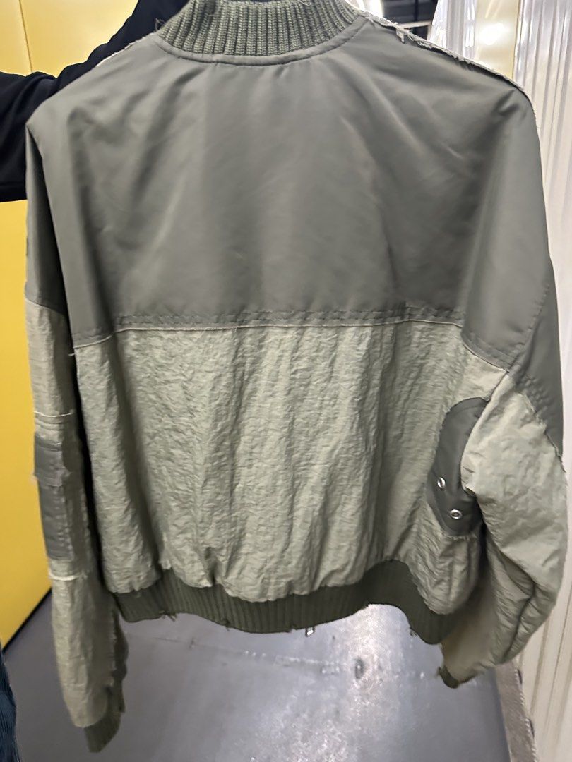 Zara Bomber Jacket Khaki Green XS (Category: Coats, Jackets and Outerwear) located in Manila. Submitted by joejoe0710 (Listing ID 1460074284, Image 3). Description: - Zara Khaki Green Bomber Jacket - Size: XS - Unique patchwork design - Distressed details for a cool vibe - Ribbed collar, cuffs, and hem - Zip-up front with convenient pockets - Ideal for stylish layering - Used once in a trip.
