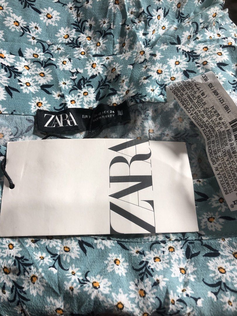 Zara Floral Print Mini Skort (Category: Skirts) located in Montevista. Submitted by rdthriftshub (Listing ID 1459983098, Image 3). Description: - Cute Zara blue floral print mini skort - Flowy design with ruffled hem - Waistline: 24 inches - Material: Cotton - Versatile for casual wear or dressing up - Pairs well with a simple top.