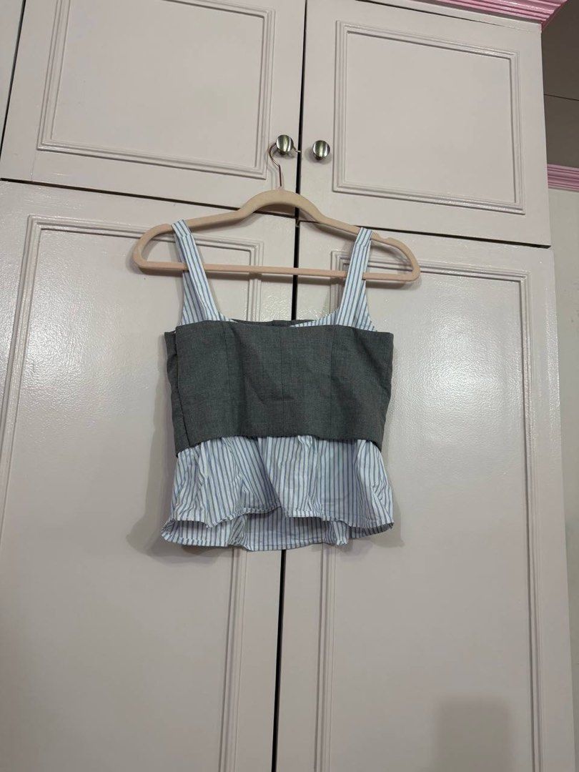 Zara Grey & Blue Striped Peplum Top XS (Category: Sleeveless) located in Quezon City. Submitted by patzyy (Listing ID 1459969721, Image 2). Description: - Grey peplum top - Blue and white pinstripe bottom - Button front detail - Square neckline with thin straps - Versatile for dressing up or down - Size XS.
