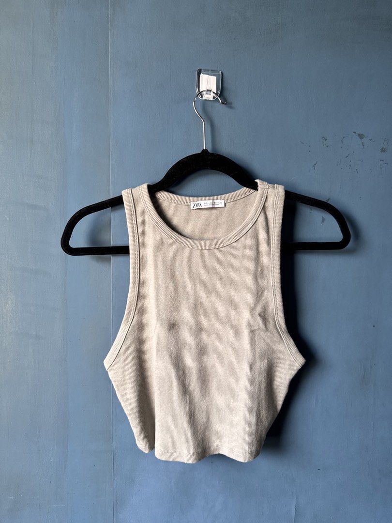 Zara Light Olive Green Ribbed Tank Top (Category: Sleeveless) located in Manila. Submitted by reesespiecess (Listing ID 1460076342, Image 1). Description: - Zara basic ribbed tank top - Light olive green color - Racerback style - Comfortable and stretchy material.