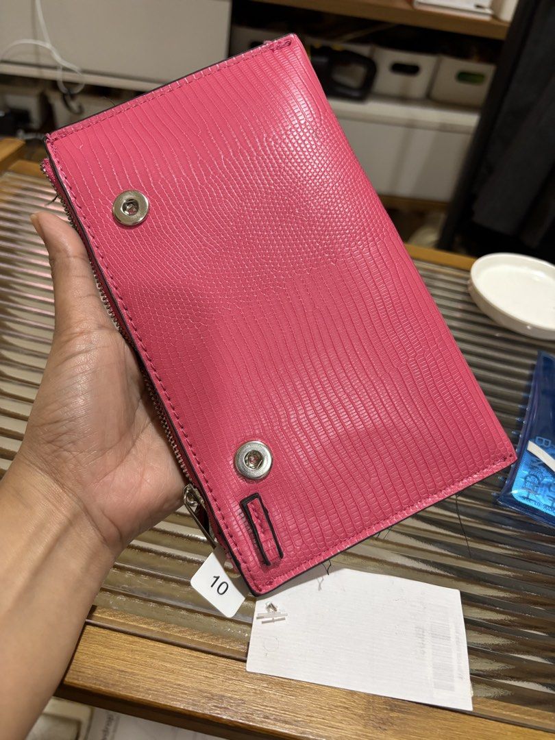 Zara Pink Textured Zip Around Wallet (Category: Wallets & Card holders) located in Las Pinas. Submitted by drecessionista (Listing ID 1459985867, Image 2). Description: - Vibrant bright pink wallet - Textured finish for a stylish look - Secure zip-around closure - Ideal for keeping your essentials organized.