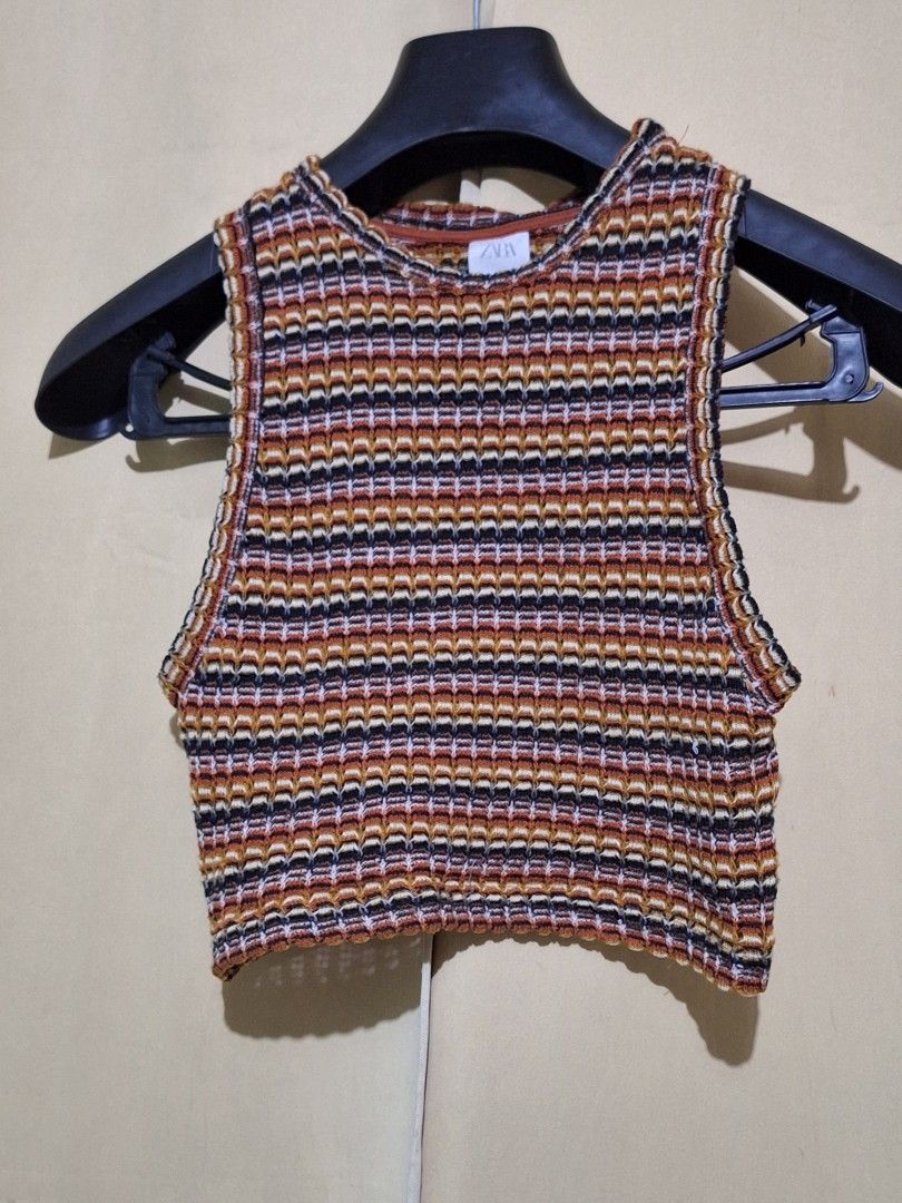 Zara Striped Knit Cropped Top (Category: Blouses) located in Manila. Submitted by viiiieve (Listing ID 1460085025, Image 1). Description: - Cute striped knit cropped top from Zara - Multicolored pattern: orange, brown, black, white - Sleeveless design with a high neckline - Made in Morocco - Great for casual wear or layering.