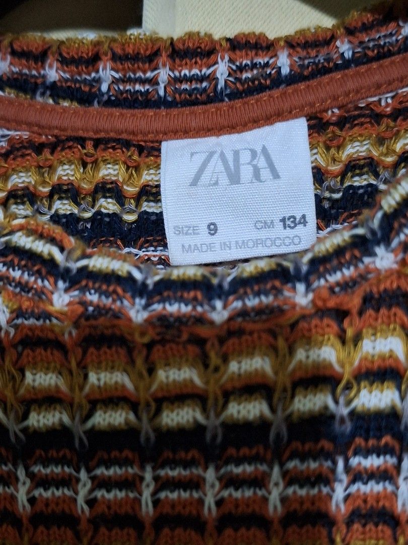 Zara Striped Knit Cropped Top (Category: Blouses) located in Manila. Submitted by viiiieve (Listing ID 1460085025, Image 3). Description: - Cute striped knit cropped top from Zara - Multicolored pattern: orange, brown, black, white - Sleeveless design with a high neckline - Made in Morocco - Great for casual wear or layering.
