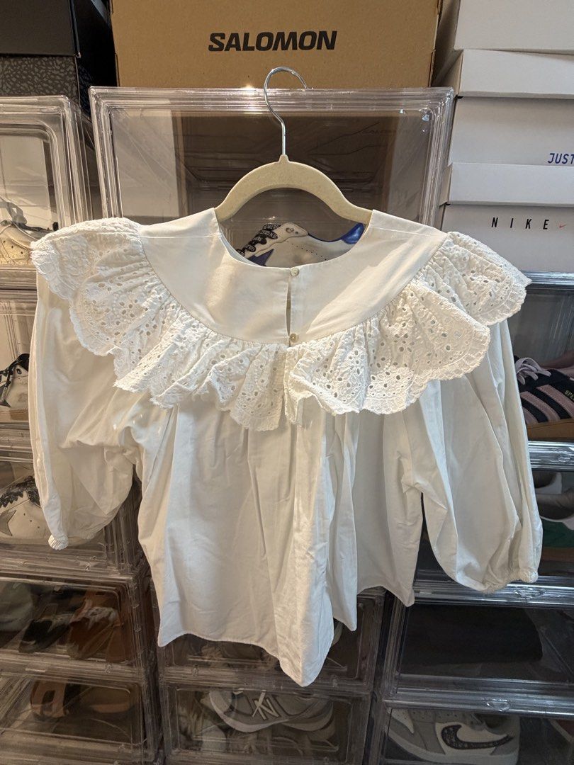 Zara White Collar Puff Sleeve Blouse (Category: Blouses) located in Pasig City. Submitted by joy_b_ (Listing ID 1460064343, Image 2). Description: - White Zara blouse - Statement broderie anglaise collar - Puff sleeves - Button-up back - Size S - Easily styled tucked into jeans or a skirt for a chic look.