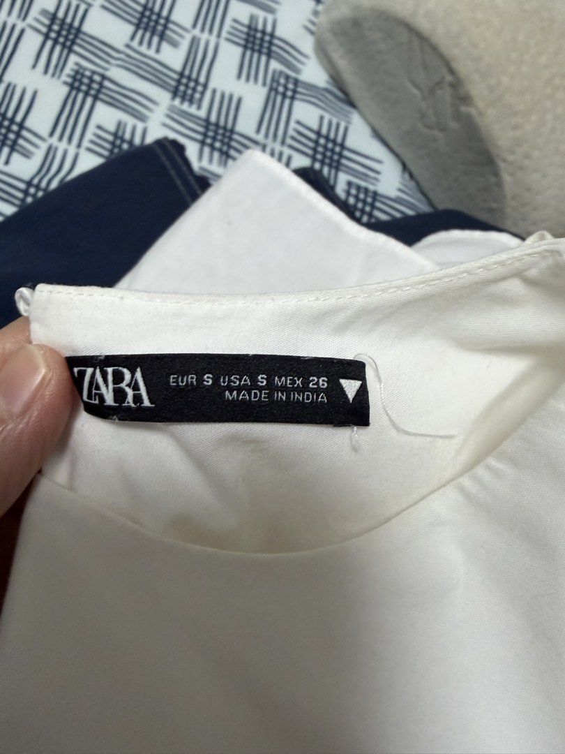 Zara White Collar Puff Sleeve Blouse (Category: Blouses) located in Pasig City. Submitted by joy_b_ (Listing ID 1460064343, Image 3). Description: - White Zara blouse - Statement broderie anglaise collar - Puff sleeves - Button-up back - Size S - Easily styled tucked into jeans or a skirt for a chic look.