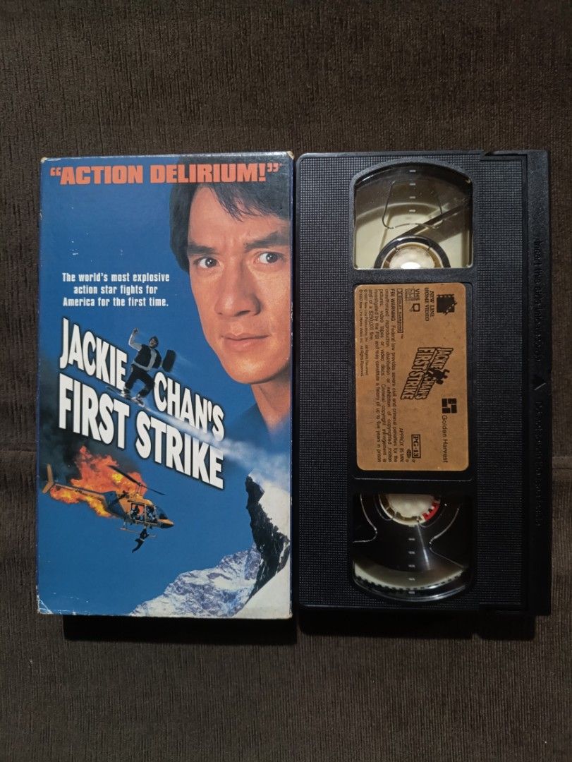 1997 Jackie Chan's First Strike VHS Tape (Category: Others) located in Quezon City. Submitted by collectandselect (Listing ID 1460266888, Image 1). Description: - Jackie Chan's First Strike VHS Tape - Features "ACTION DELIRIUM!" on cover - Released by New Line Home Video and Golden Harvest - Rated PG-13 - A must-have for Jackie Chan fans! WALANG AMAG! .