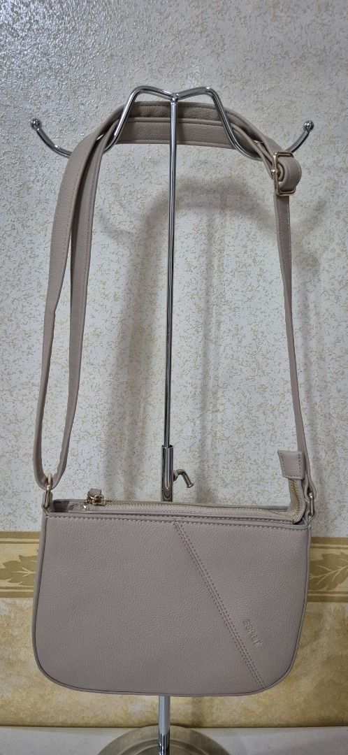 A22-499 Esprit Oat Sling Bag (Category: Cross-body Bags) located in Valenzuela. Submitted by dailyhappyfinds (Listing ID 1460259059, Image 2). Description: BRAND: Esprit -Brand new without tag -Sling bag -Please check last photo for details *Mall pullout/ factory pullout. Please manage your expectations..