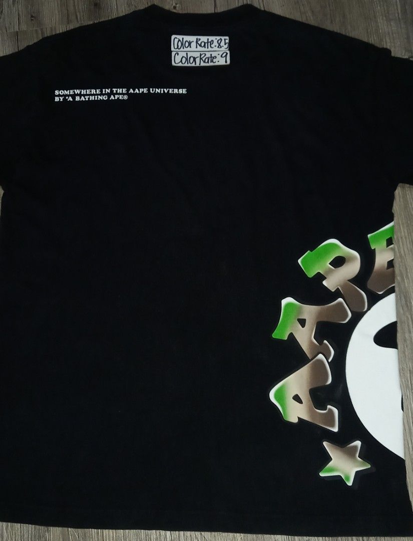 A Bathing Ape AAPE Universe Black Side Logo (Category: Tshirts & Polo Shirts ) located in Imus. Submitted by pampie (Listing ID 1460157506, Image 2). Description: - Brand: AAPE by A Bathing Ape - Color: Black - Size: L to XL (please check measurements) - Front Graphic: "Apes and Planet Earth" - Back Graphic: "Somewhere in the Aape Universe" - Material: 100% Cotton - Style: Streetwear essential.