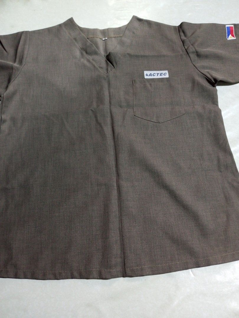 ACTEC Scrub Top and Pants Set (Category: Activewear) located in Malolos. Submitted by radapostol (Listing ID 1460163198, Image 1). Description: - Brown scrub top and pants set. - Top features a V-neck and a chest pocket with ACTEC logo. - Pants have a comfortable elastic waistband. - Ideal for medical professionals..