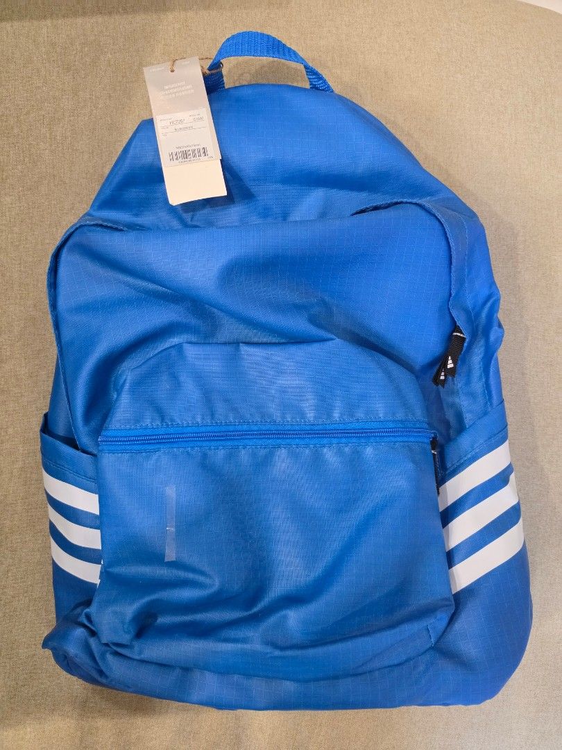 Adidas Backpack (Category: Backpacks) located in Manila. Submitted by leap888.leap888 (Listing ID 1460250173, Image 1). Description: - Blue Adidas backpack with iconic white stripes - 100% Authentic / Original and Brand New - Front zip pocket for easy access - Padded straps for comfortable carrying - Features 'END PLASTIC WASTE' tag - Size: NS (32cm x 47cm x 15cm) - Article number: HC7257 - Model number: G1990 - Ideal for everyday use, school, or