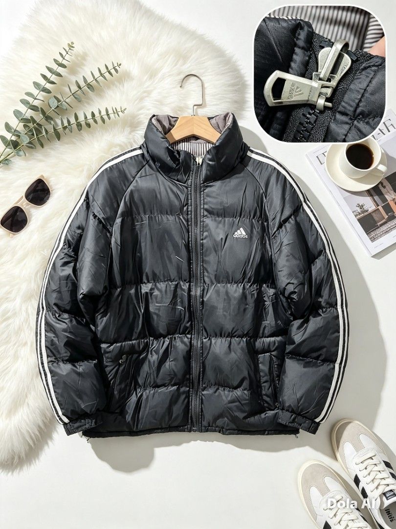 Adidas Black Puffer Jacket with White Stripes (Category: Coats, Jackets and Outerwear) located in Manila. Submitted by momofunodos (Listing ID 1460175592, Image 1). Description: Black Adidas puffer jacket. Features white stripes on the sleeves. Stand-up collar. Zip closure. Two side pockets. Warm and comfortable for cooler weather..