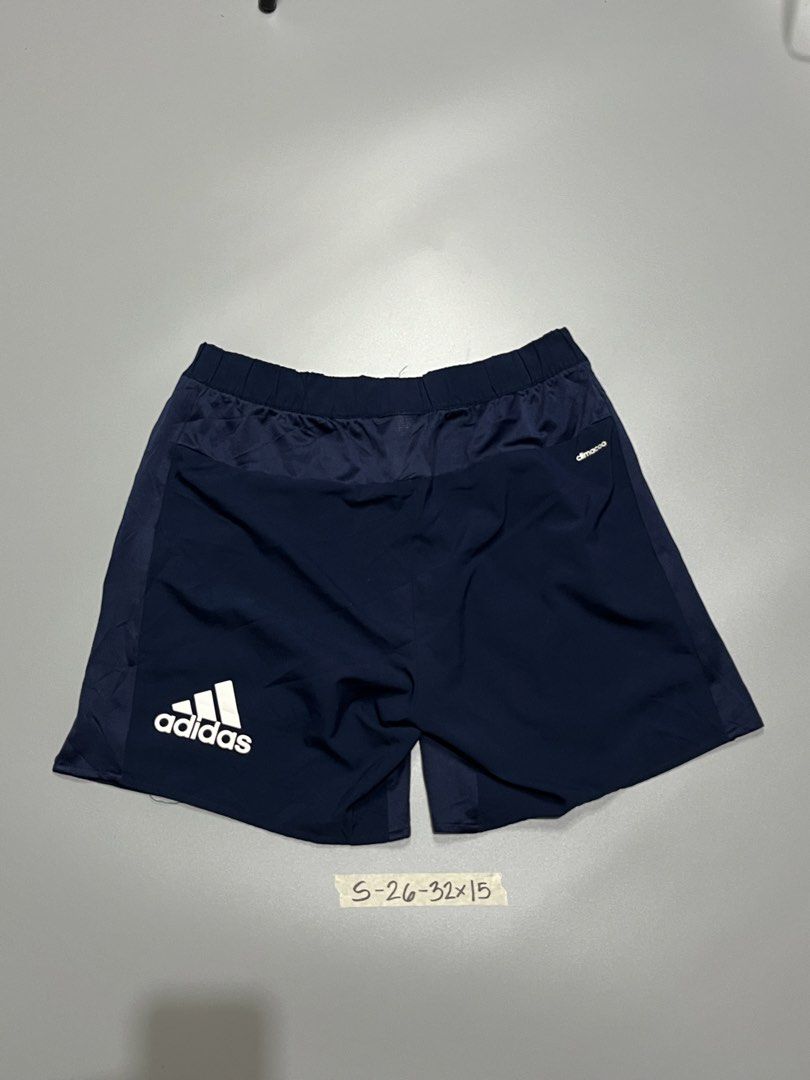 Adidas Climalite Navy Blue Athletic Shorts (Category: Shorts) located in Manila. Submitted by jorgemabelin2001 (Listing ID 1460192923, Image 1). Description: - Navy blue Adidas shorts - Climalite fabric for breathability - Elastic waistband with adjustable drawstring - Versatile for sports or casual wear - Adidas logo detail on leg - Tag size: S (fits waist 26-32 inches), 15 inch length.