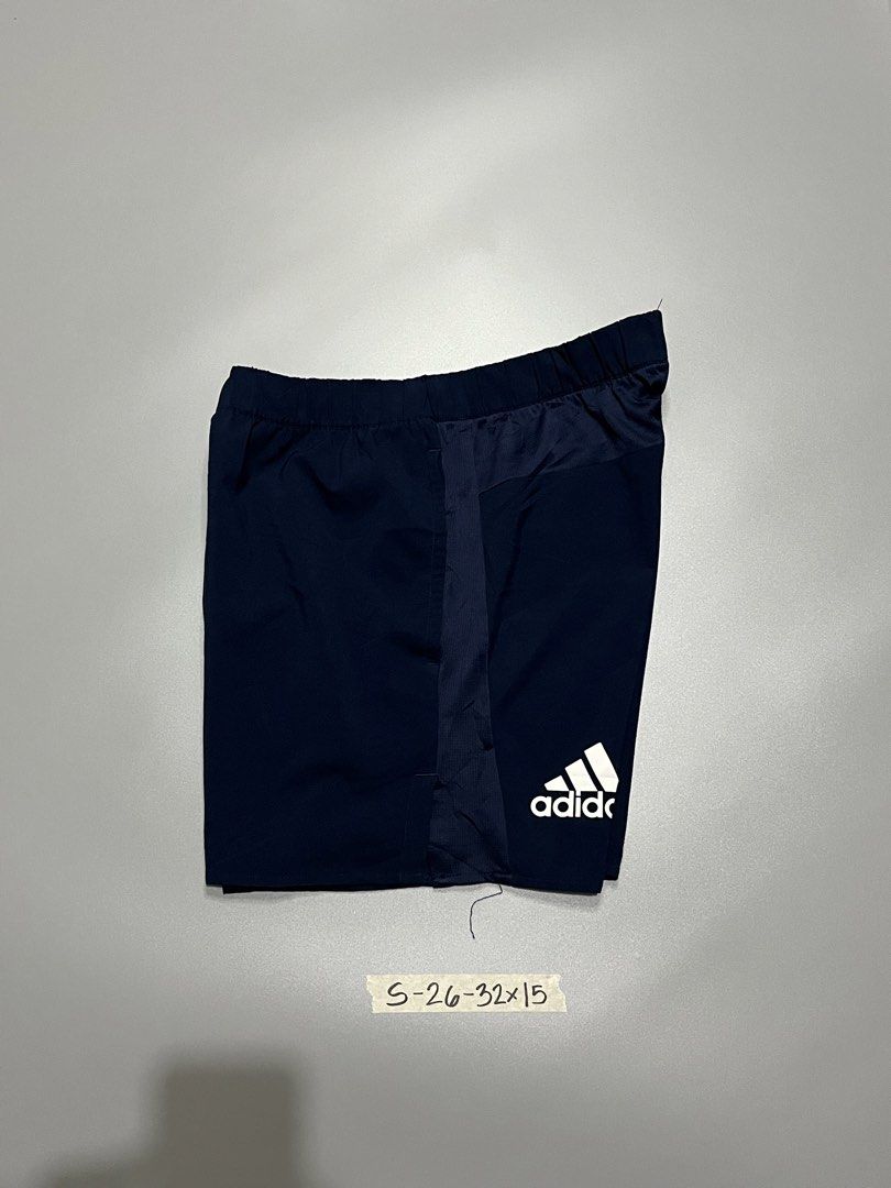 Adidas Climalite Navy Blue Athletic Shorts (Category: Shorts) located in Manila. Submitted by jorgemabelin2001 (Listing ID 1460192923, Image 2). Description: - Navy blue Adidas shorts - Climalite fabric for breathability - Elastic waistband with adjustable drawstring - Versatile for sports or casual wear - Adidas logo detail on leg - Tag size: S (fits waist 26-32 inches), 15 inch length.