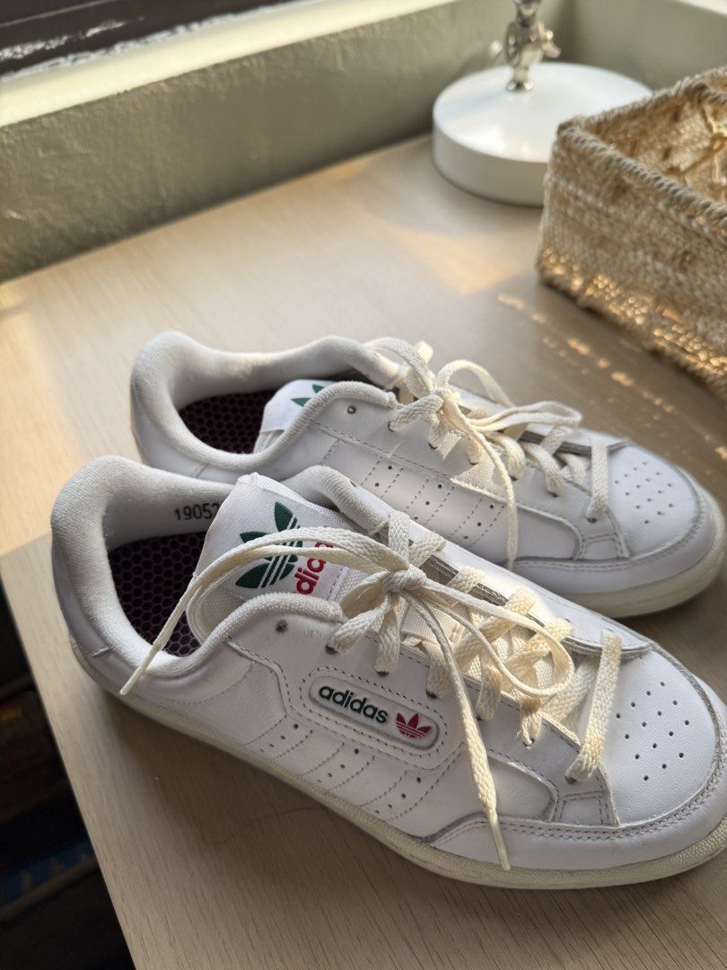 Adidas Continental 80 White Sneakers (Category: Sneakers) located in Manila. Submitted by itgirlph (Listing ID 1460222542, Image 1). Description: - Classic white Adidas Continental 80 sneakers - Size: 6.5 UK - Condition: Minor scuffs on toe box and soles from normal wear - Plenty of life left, great for everyday wear.
