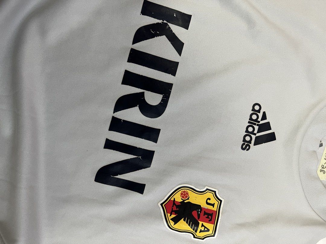 Adidas JFA Kirin Sleeveless Jersey (Category: Vests) located in Mabalacat. Submitted by aas_thriftfings (Listing ID 1460187013, Image 3). Description: - Adidas JFA Japan sleeveless jersey vest - Size: Large (L) - Features Kirin sponsor logo - Clima365 technology for enhanced breathability - FORMOTION design for an athletic fit - Ideal for training sessions or casual wear.