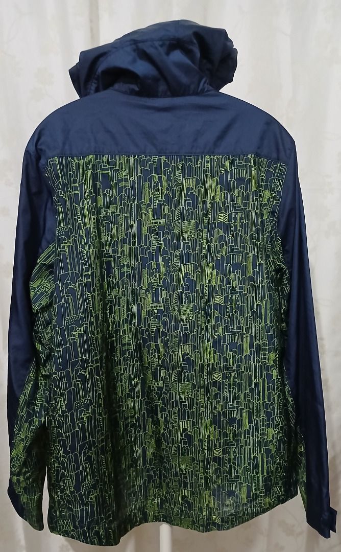Adidas Neo Label Hooded Windbreaker Jacket (Category: Coats, Jackets and Outerwear) located in Makati City. Submitted by chamarket.2022 (Listing ID 1460253187, Image 3). Description: Navy blue Adidas windbreaker with a cool lime green city graphic print. Hooded design. Mesh lining inside. Size S. Great for light rain or wind protection. Perfect for casual wear or sports. Material: 100% polyester Note: faded design at the lower back of jacket..