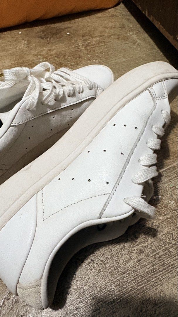 Adidas Sleek Super White Leather Sneakers (Category: Sneakers) located in Manila. Submitted by cleverriver-4879 (Listing ID 1460238797, Image 3). Description: - Classic white Adidas sneakers - Genuine leather material - Lace-up closure - Super clean and versatile for everyday wear - Minor scuffs on the sole from normal use - Plenty of life remaining.