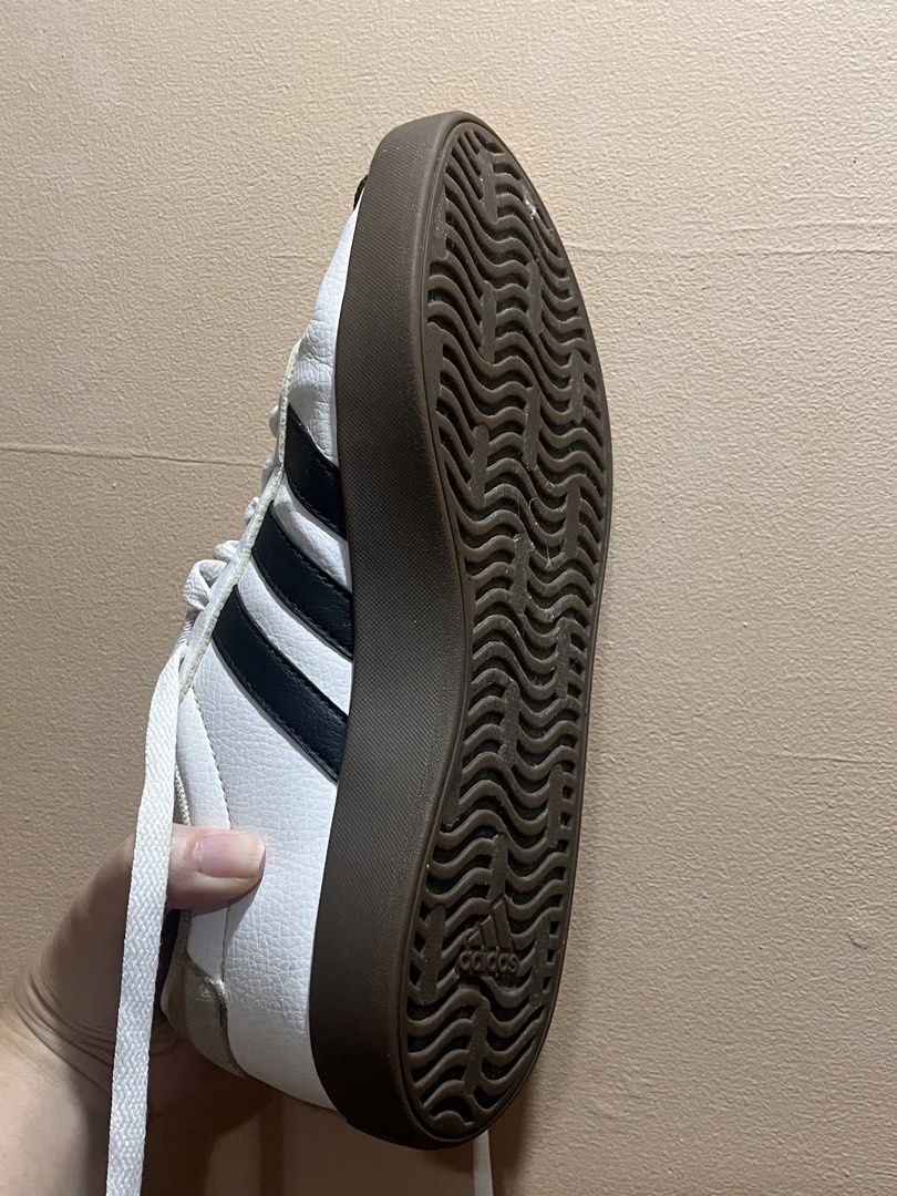 Adidas White Sneakers (Category: Sneakers) located in Manila. Submitted by _declutterbyleb (Listing ID 1460211956, Image 3). Description: - Classic white Adidas sneakers - black stripes for a sporty look - Suede toe cap detail for added texture - Durable brown rubber sole - Lace-up closure for a secure fit - Made in Vietnam - Size: US 6 / UK 4.5 / FR 37.5.