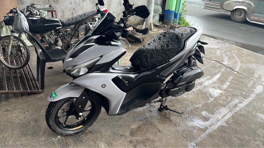 Aerox V2 2023 (Category: Motorbikes for Sale) located in Manila. Submitted by dycluterring_7 (Listing ID 1460118587, Image 2). Description: ODO: 18k Issue: may gasgas sa gilid at headlight. As seen sa pics Original michilin tire worth 12k FREE: TPO bracket at top box .