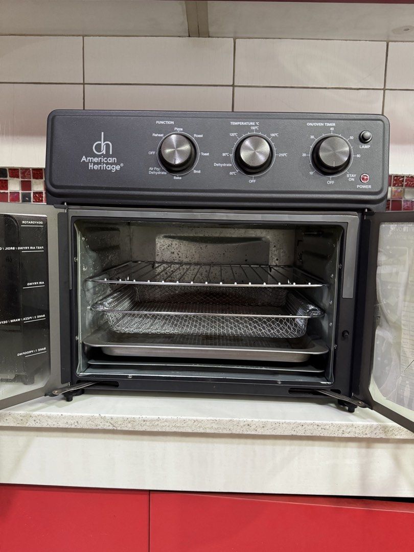 Air Fryer Oven (Category: Ovens & Toasters) located in Manila. Submitted by rnc.shop (Listing ID 1460245025, Image 2). Description: American Heritage 10-in-1 French Door Air Fryer Oven (AHAFO-6307) Capacity: 25 liters Technology: 360° Hot Air Technology with 1700W of power (230V, 60Hz) 10-in-1 Functions: Air Fry, Dehydrate, Reheat, Pizza, Roast, Rotisserie, Toast, Broil, Bake, and Grill Design: Sleek French doors with a lighted interior cavity Co