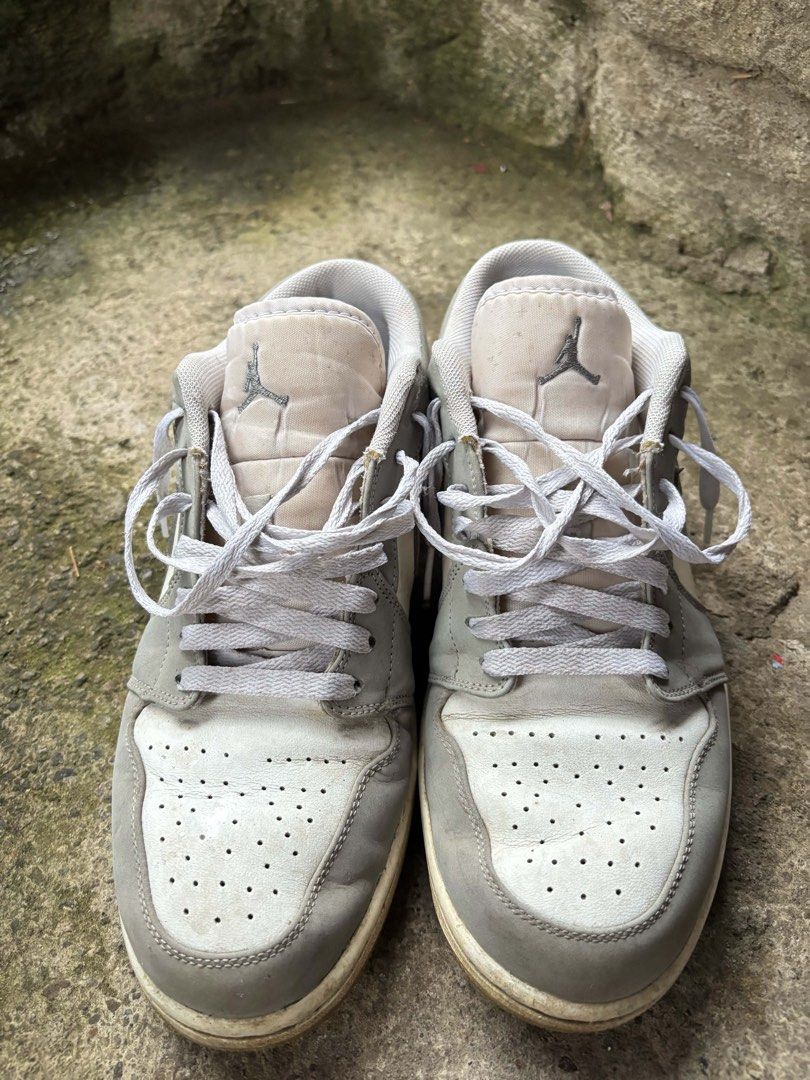 Air Jordan 1 Low “White/Wolf Grey” Sneakers (Category: Sneakers) located in Santa Cruz. Submitted by ashgennn (Listing ID 1460153560, Image 1). Description: size 9 need cleaning no issues - signs of usage only.