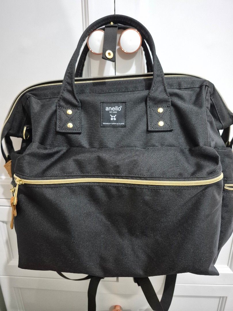 Anello Backpack Black Gold Zippers (Category: Backpacks) located in Makati City. Submitted by mckie (Listing ID 1460132657, Image 1). Description: - Anello backpack in classic black - Stylish gold zippers - Multiple compartments and pockets for organization - Comfortable padded straps - Spacious interior, ideal for daily use or travel.
