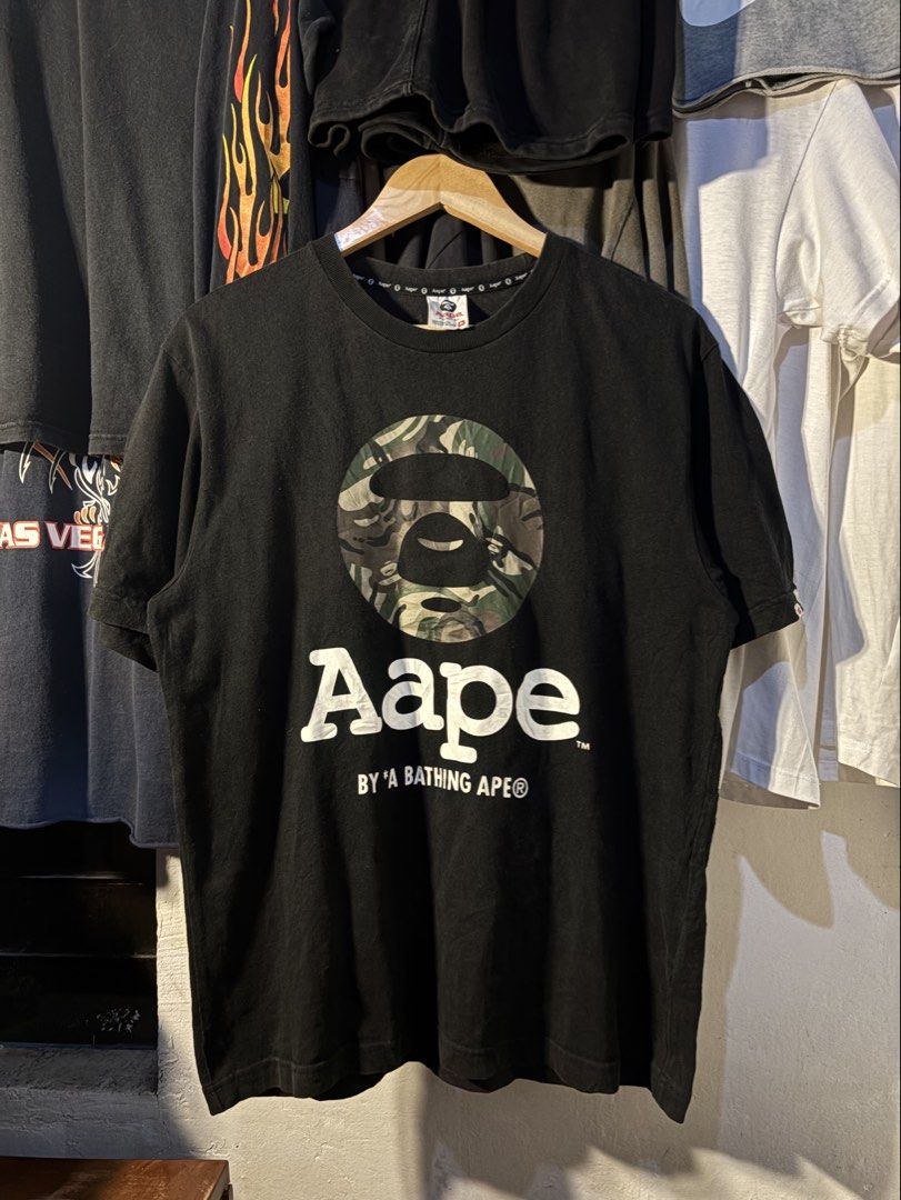 AAPE BATHING APE CAMO MOON FACE (Category: Tshirts & Polo Shirts ) located in San Jose. Submitted by jerown (Listing ID 1460223841, Image 2). Description: •L28 x W21 •EXCELLENT CONDITION •COLOR RATE 9.5/10 or better •ALL DETAILS ARE POSTED •NO ISSUE.