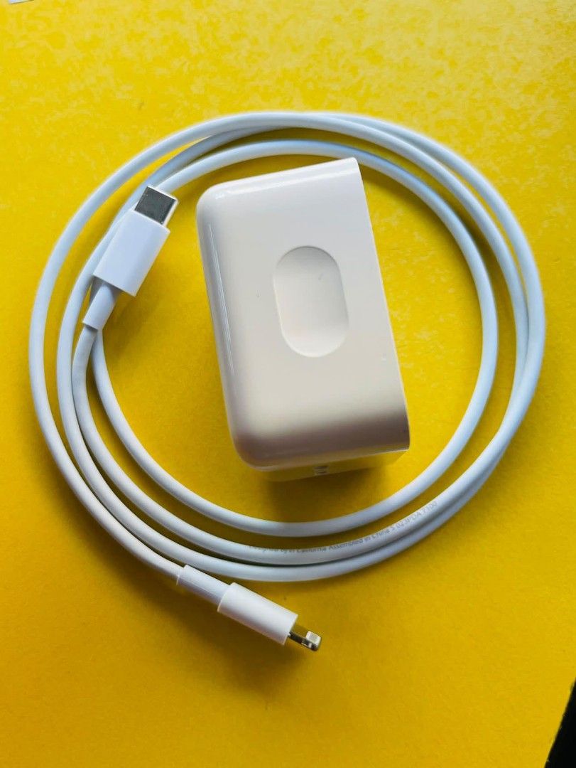 Apple USB-C Power Adapter with USB-C to Lightning Cable (Category: Chargers & Cables) located in Manila. Submitted by bloodyrain (Listing ID 1460272303, Image 3). Description: - Apple USB-C Power Adapter - Features two USB-C ports - Comes with a USB-C to Lightning cable - Ideal for fast charging iPhones, iPads, and MacBooks - Compatible with a wide range of Apple devices.
