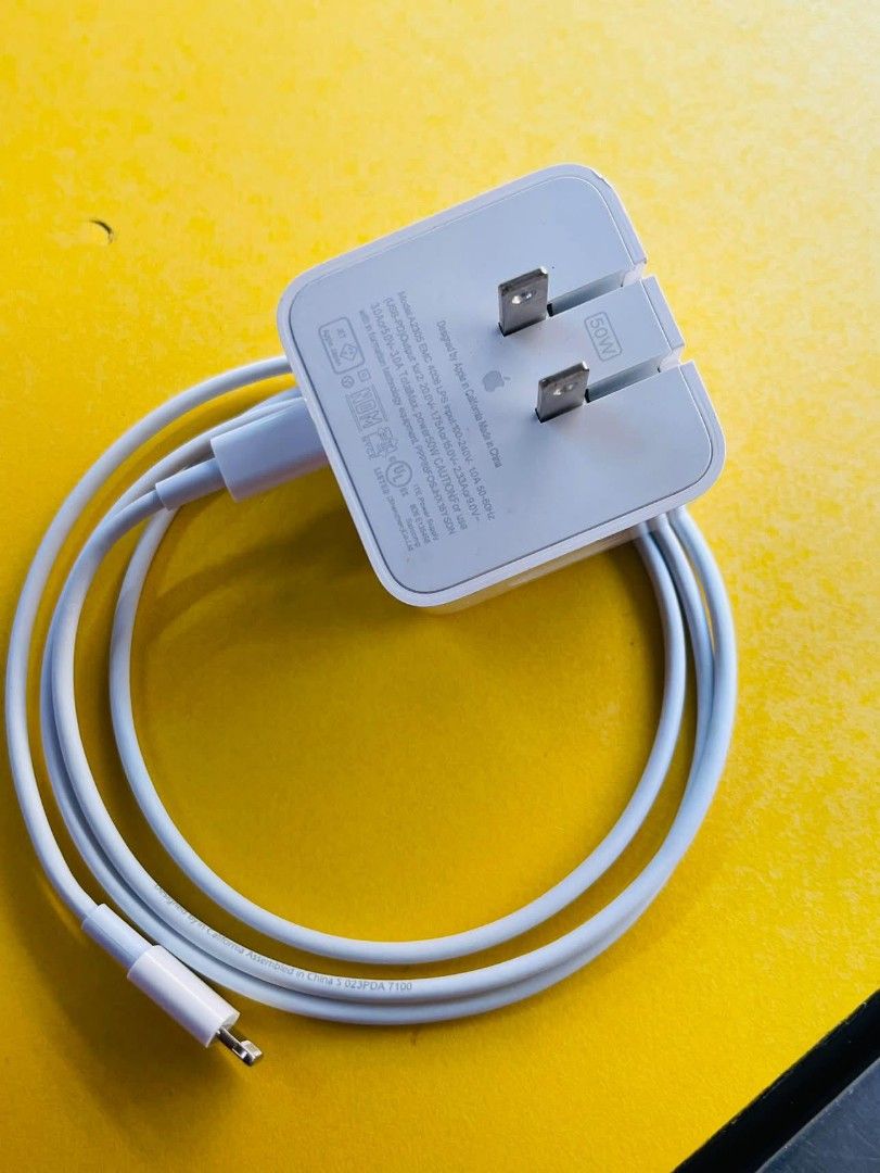 Apple USB-C Power Adapter with USB-C to Lightning Cable (Category: Chargers & Cables) located in Manila. Submitted by bloodyrain (Listing ID 1460272303, Image 2). Description: - Apple USB-C Power Adapter - Features two USB-C ports - Comes with a USB-C to Lightning cable - Ideal for fast charging iPhones, iPads, and MacBooks - Compatible with a wide range of Apple devices.
