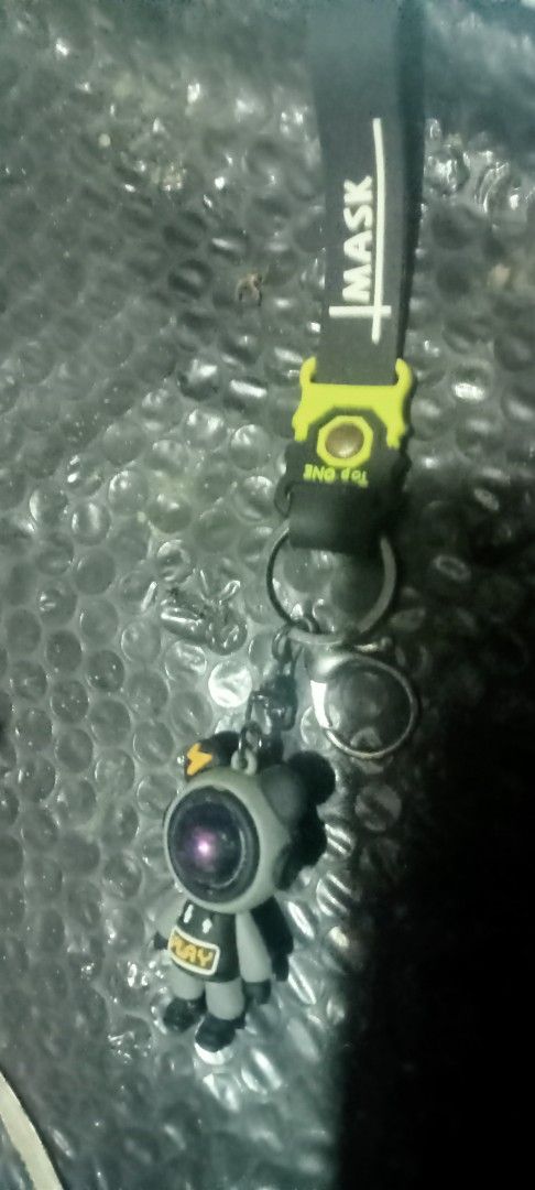 Astronaut Keychain with Lanyard (Category: Character Goods) located in Paranaque City. Submitted by dimaguilaa94969 (Listing ID 1460220750, Image 1). Description: - Adorable astronaut charm keychain - Includes a black lanyard with 'MASK' and 'TOP ONE' text - Astronaut has unique purple eye. if int 09260966619 lenses - Ideal accessory for bags or keys - A unique and eye-catching item.